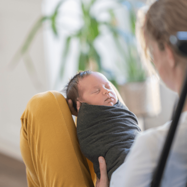 Mum-holding-swaddled-newborn-baby